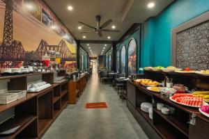 a buffet line in a restaurant with food on display at Elegance Premium Hotel in Hanoi