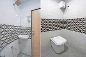 a bathroom with a toilet and a sink at Super Hotel O Ugat Canal Surat Formerly Royal Orbit in Rānder