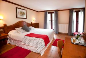 Letto o letti in una camera di Hotel Montané