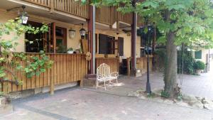 a building with a bench in front of it at CB Hotel Becker in Nieder-Olm