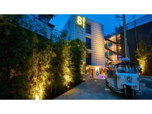 a vehicle parked in a parking lot in front of a building at 8HOTEL CHIGASAKI - Vacation STAY 87545v in Chigasaki