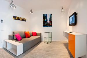 a living room with a couch and a tv at Partner Guest House in Kyiv