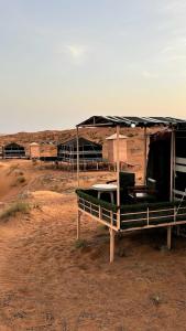 a tent in the middle of the desert at Sunrise Desert Local Private Camp in Badīyah +34 photos