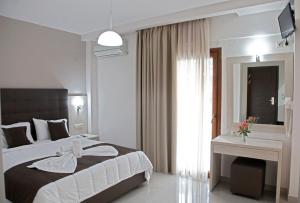 Кровать или кровати в номере Kochili Seashell Apartments