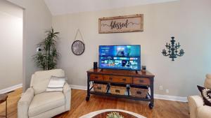 a living room with a flat screen tv on a table at 2196 Major Loring Way SW Marietta in Macland