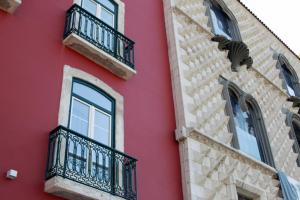 a row of windows on a building at Hotel Riverside Alfama in Lisbon