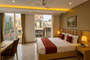 Postel nebo postele na pokoji v ubytování Perfectstayz Premium Kaashin near Kashi Ghat