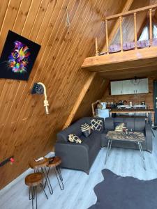 a living room with a couch and a loft at Yalova Kasaba Bungalov in Çınarcık