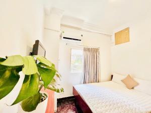 Ένα ή περισσότερα κρεβάτια σε δωμάτιο στο New Sunny Hotel