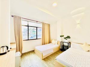 Ένα ή περισσότερα κρεβάτια σε δωμάτιο στο New Sunny Hotel