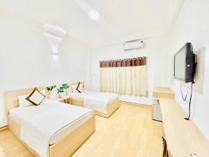 Ένα ή περισσότερα κρεβάτια σε δωμάτιο στο New Sunny Hotel