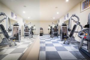a gym with treadmills and elliptical machines at Hotel Bellevue - Liburnia in Opatija