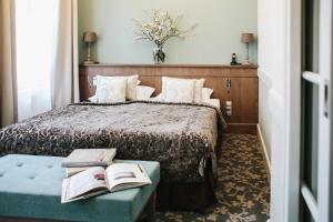 Postel nebo postele na pokoji v ubytování Art Hotel