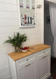 a counter in a room with a picture on the wall at Wyreema, Heritage Cottage in Geelong West