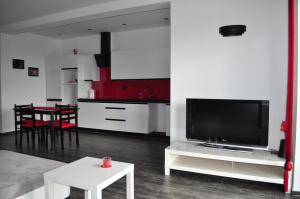 TV a/nebo společenská místnost v ubytování Apartament Scorpion Modlin