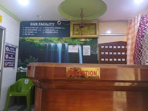 a sign on the wall of a room at AGH Residency Triplicane in Chennai