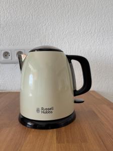 a black and white toaster sitting on a table at La VIE EST BELLE in Gassin