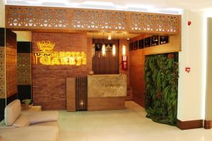 a lobby of a hotel with a sign that reads hotel garden at Hotel Panorama Gareji in Sagarejo
