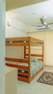 a bedroom with two bunk beds in a room at Family Space in Dhaka