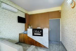 a hotel lobby with a sign on a counter at Super Collection O Sunder Nagar Golvyas Formerly Hotel Vanshil in Jaipur