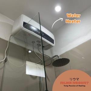 a water heater sitting on top of a ceiling at Riuma Resort in Karangploso