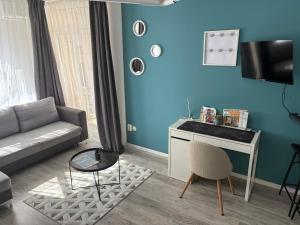 TV a/nebo společenská místnost v ubytování ÁTRIUM Apartman Kaposvár + 26 fotografií