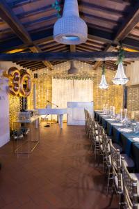 a banquet hall with a long table and chairs at Tenuta La Borriana in Carmignano +61 photos