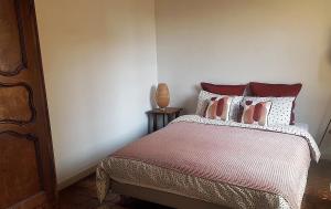 a bedroom with a bed with two pillows at Maison Forte DES GRANDS MAISONS in Cogny +32 photos