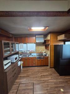 Kuchyň nebo kuchyňský kout v ubytování かんさんのお宿