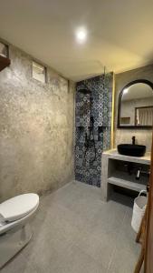 a bathroom with a toilet and a sink at Casa Ola Canggu in Pererenan +14 photos