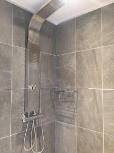 a shower with a glass door in a bathroom at Le Turenne in Bordeaux +30 photos