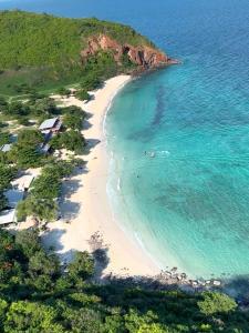 an aerial view of a beach with people in the water at Z8 beach hotel in Jomtien Beach
