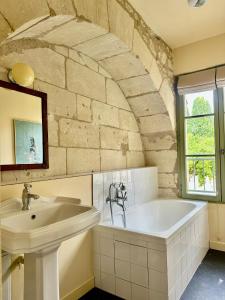 a bathroom with a sink and a bath tub at Auberge Radieuse in Azay-le-Rideau +47 photos