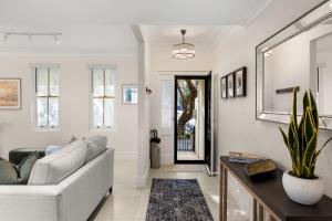 a living room with a couch and a table at Beautiful Terrace Home with Courtyard in Newcastle