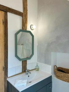 a bathroom with a sink and a mirror at Family Home In The Alpes Mancelles in Moulins-le-Carbonnel