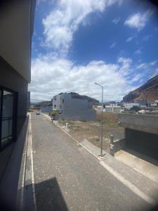 an empty street with a building and a street light at Cisa home in Prainha