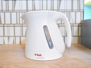 a white tea kettle sitting on a table at Rakuten STAY Fukuoka-Yakuin - Vacation STAY 28612v in Fukuoka +14 photos