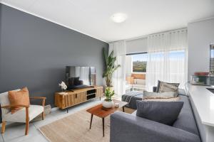 a living room with a couch and a table at Ballito Hills 824 in Ballito