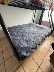a mattress on a bunk bed in a room at Appartement dans maison au calme in Forbach