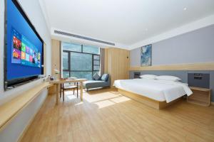 Ένα ή περισσότερα κρεβάτια σε δωμάτιο στο Imperial Dragon Bay Mandala Hotel