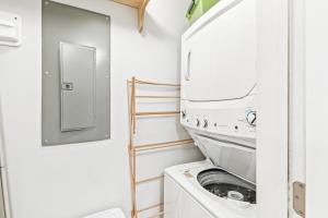 a laundry room with a washer and dryer at Lagoon Villa 25 - Heart of Wild Dunes, Quick Walk to Beach in Isle of Palms