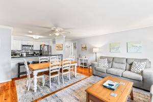 a living room with a couch and a table at Lagoon Villa 25 - Heart of Wild Dunes, Quick Walk to Beach in Isle of Palms