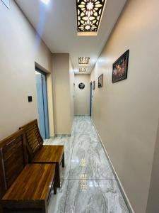 a hallway with a bench and a ceiling at North paradise in Cochin