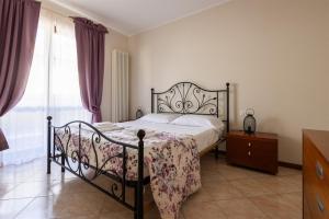 En eller flere senge i et værelse på IseoLakeRental - Sole