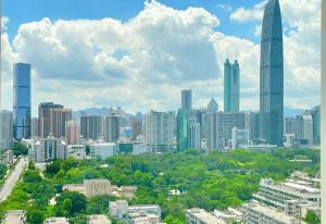 a city skyline with tall buildings and trees at 深圳四川宾馆-福田华强北&双地铁口直达&免费停车 in Shenzhen