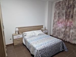 Ένα ή περισσότερα κρεβάτια σε δωμάτιο στο Apartamento el Salao