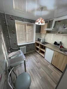 a kitchen with a sink and a counter top at ApartCenter апартаменты в центре Gagarin mall in Kryvyi Rih