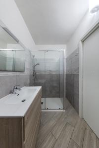 a bathroom with a shower and a white sink at San Carlo Borromeo in Soiano del Lago +50 photos