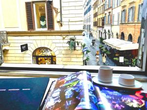 a view of a street with hats on a table at DUNE at Spanish Steps Luxury Apartment-Suite in Rome