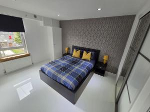 Postel nebo postele na pokoji v ubytování Gordon Street Aparthotel